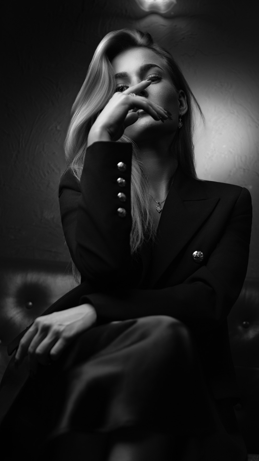 Black-and-white fashion portrait on location