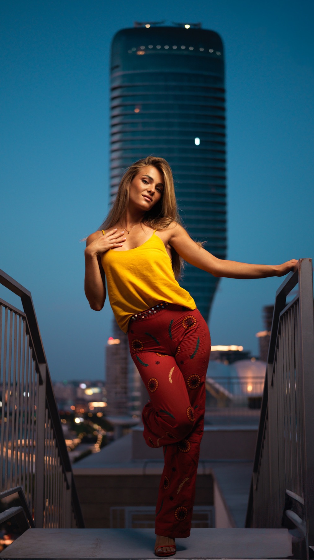 Fashion portrait on an urban bridge at blue hour