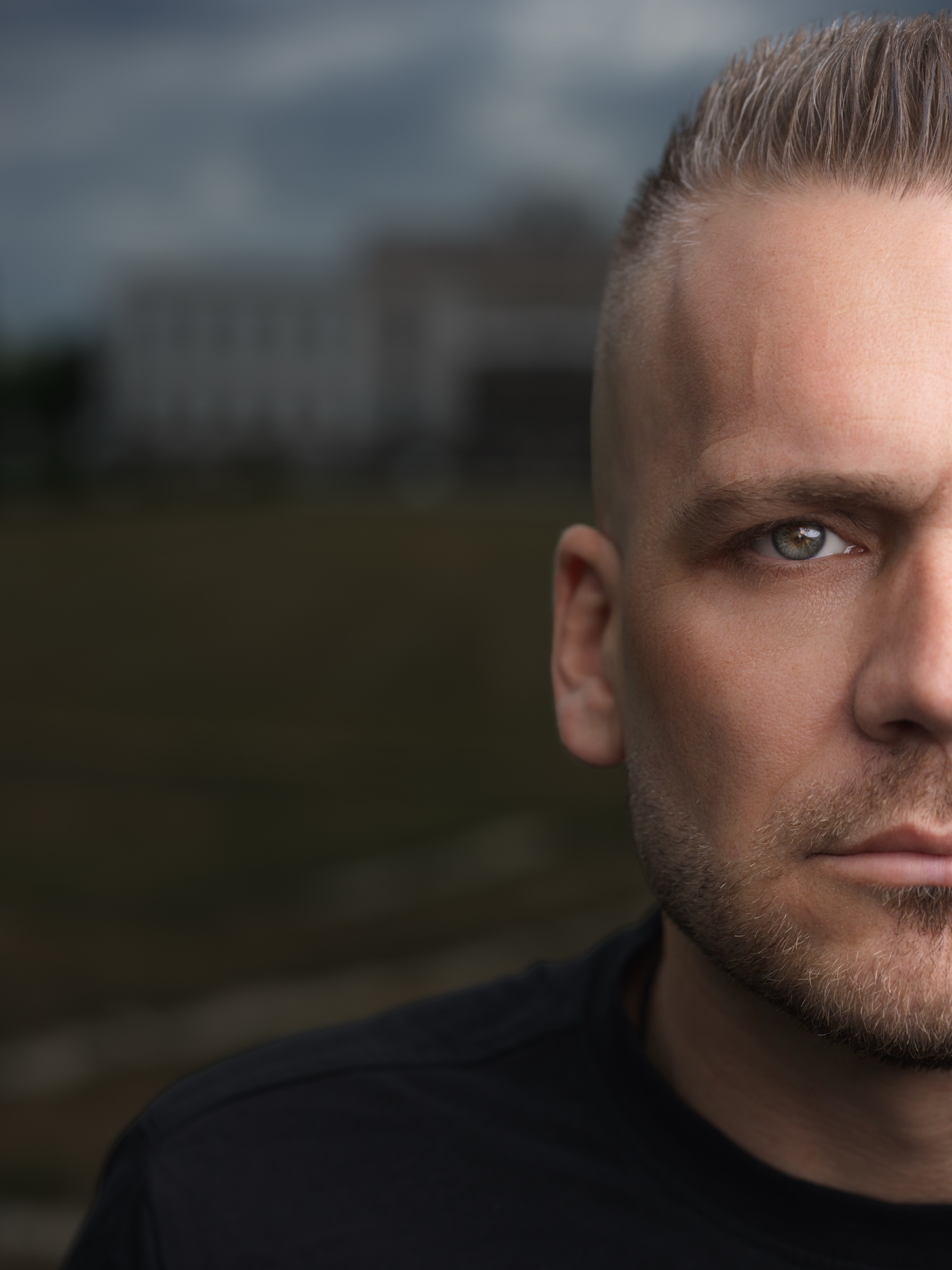 Close editorial portrait of a man outdoors